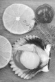 raw scallop with slice lemon, tomato and thyme on a wooden board