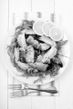 cooked crab claws with salad on a plate, read to eat