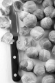 cleaned brussels sprout and kitchen knife