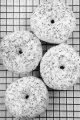 baked donut with colorful sprinkles on a cooling rack