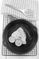 grilled cod with lime and lemon slice in a cast iron pan