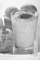 apple and orange smoothie with chia seed in a glass