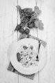 vegetarian pasta salad with healthy radishes and fresh spring onions