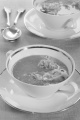 creamy carp soup with sour cream in a double handled soup bowl